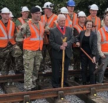 Royal Engineer soldiers, who helped install British Steel track, and dignitaries at the Llanelli & Mynyd Mawr Railway.