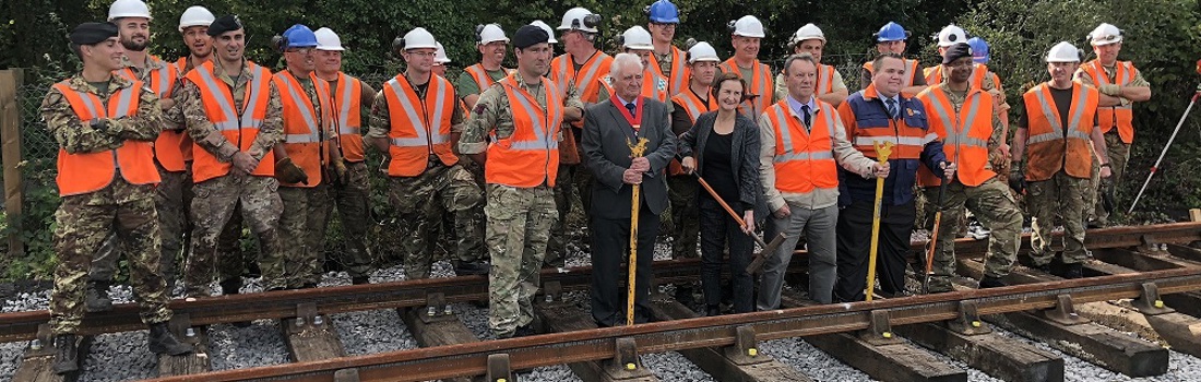 Royal Engineer soldiers, who helped install British Steel track, and dignitaries at the Llanelli & Mynyd Mawr Railway.