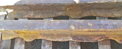 Corrosion protected rail crossing British Steel