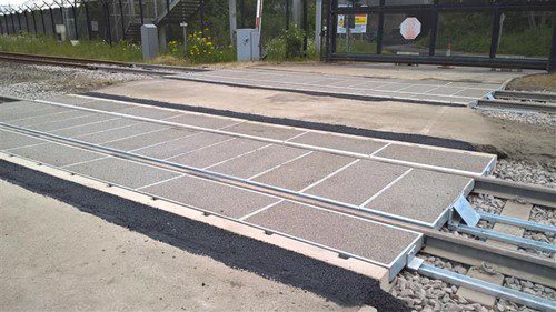 Corrosion protected rail crossing British Steel