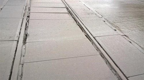 Corrosion protected rail crossing British Steel